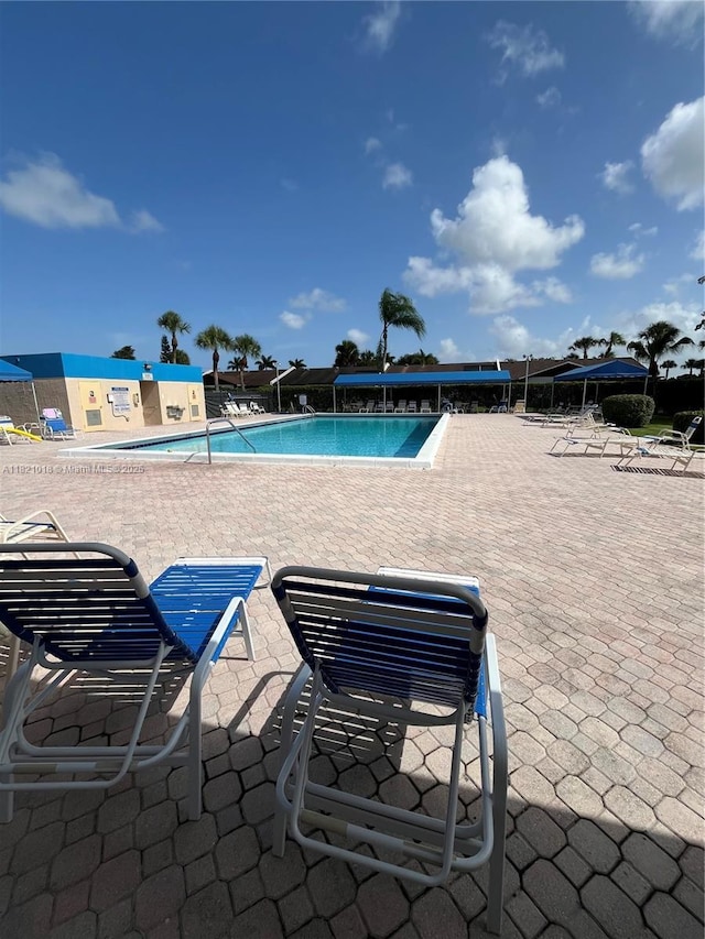 5160 Las Verdes Cir Unit 103, Delray Beach, FL 33484 - community pool featuring a patio