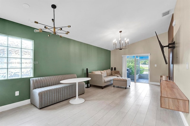 142 SW 204th Ave, Pembroke Pines, FL 33029 - living area with a chandelier, vaulted ceiling, and wood finished floors