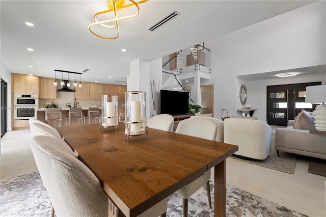 3002 SW 151st Ct, Miami, FL 33185 - dining room with concrete flooring and recessed lighting