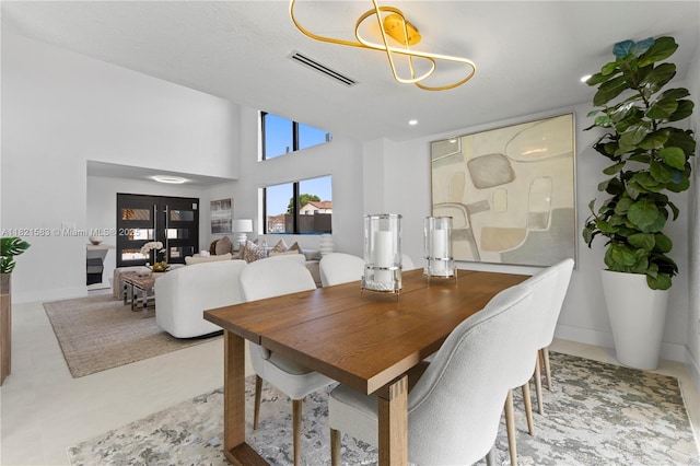 3002 SW 151st Ct, Miami, FL 33185 - dining area with a towering ceiling and baseboards