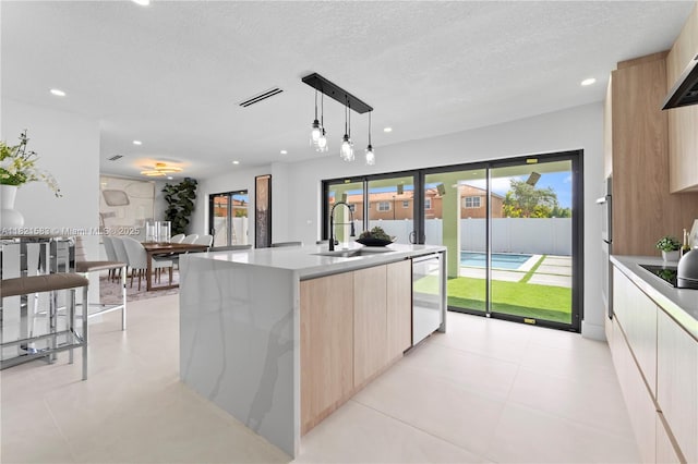3002 SW 151st Ct, Miami, FL 33185 - kitchen featuring modern cabinets, light brown cabinets, dishwashing machine, light countertops, and recessed lighting