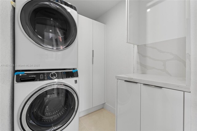 3002 SW 151st Ct, Miami, FL 33185 - washroom with estacked washer and dryer and cabinet space