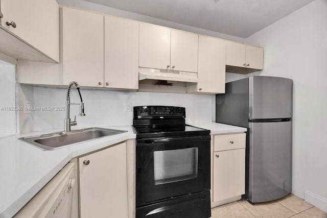7403 SW 82nd St Unit 207N, Miami, FL 33143 - kitchen featuring under cabinet range hood, electric range, freestanding refrigerator, white dishwasher, and light countertops