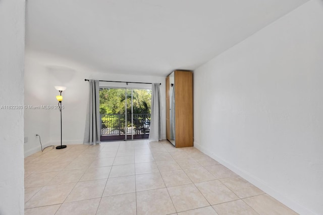 7403 SW 82nd St Unit 207N, Miami, FL 33143 - empty room with light tile patterned floors