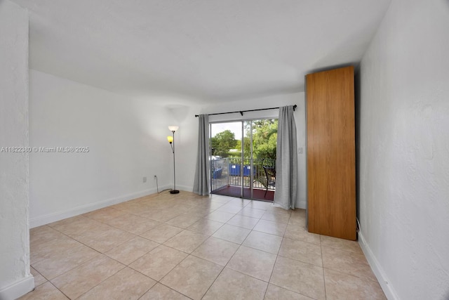 7403 SW 82nd St Unit 207N, Miami, FL 33143 - unfurnished room featuring light tile patterned flooring and baseboards
