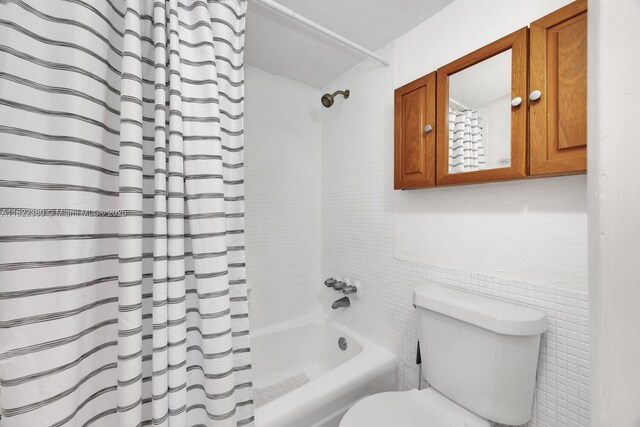 7403 SW 82nd St Unit 207N, Miami, FL 33143 - full bathroom with shower / bath combo with shower curtain and tile walls