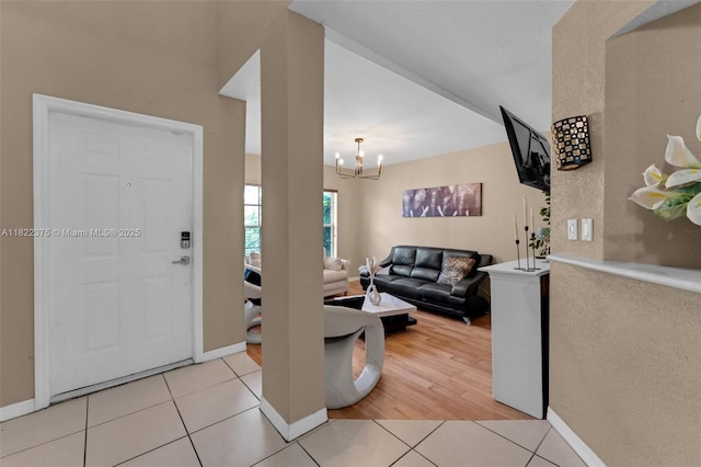 16101 SW 104th Ter, Miami, FL 33196 - entrance foyer featuring light tile patterned flooring and a chandelier