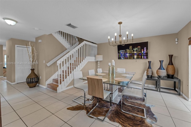 16101 SW 104th Ter, Miami, FL 33196 - dining room with stairs, tile patterned floors, and a chandelier