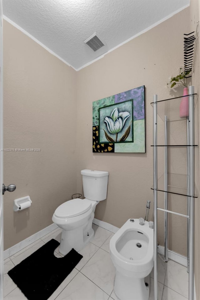 16101 SW 104th Ter, Miami, FL 33196 - bathroom with a textured ceiling, a bidet, marble look tile flooring, and ornamental molding