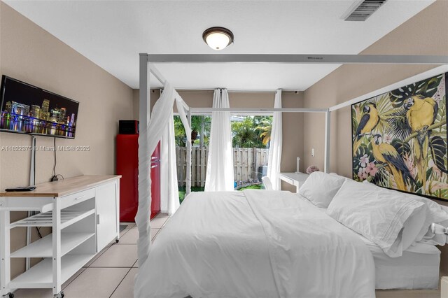 16101 SW 104th Ter, Miami, FL 33196 - bedroom with light tile patterned flooring and access to outside