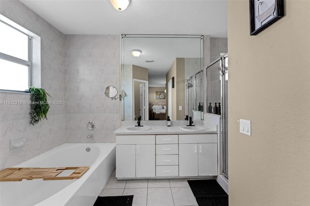 16101 SW 104th Ter, Miami, FL 33196 - full bathroom with a garden tub, double vanity, tile patterned flooring, and a stall shower