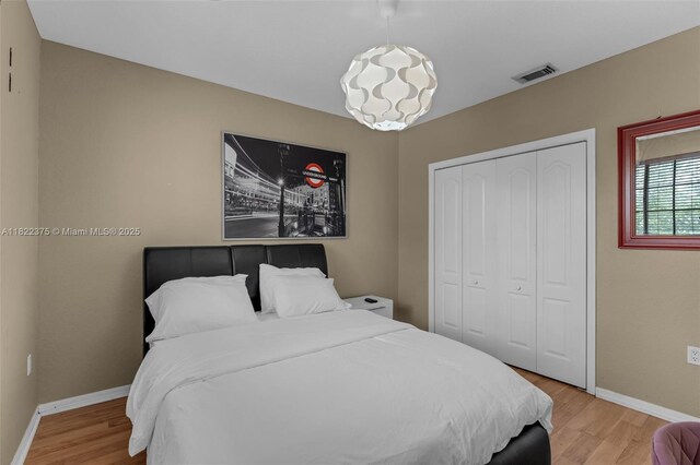 16101 SW 104th Ter, Miami, FL 33196 - bedroom featuring light wood-type flooring and a closet
