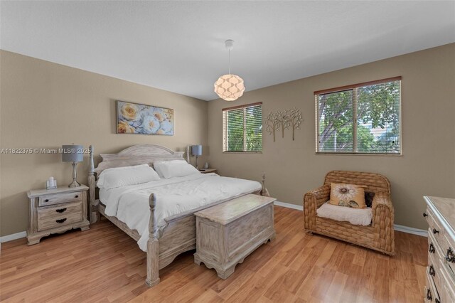 16101 SW 104th Ter, Miami, FL 33196 - bedroom with light wood-style flooring and baseboards