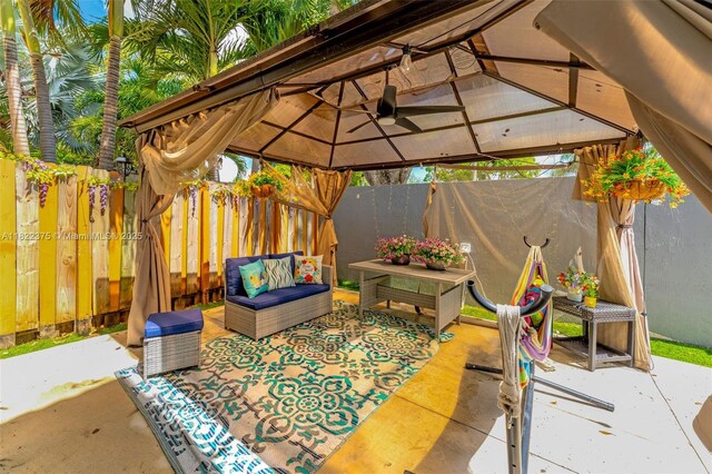 16101 SW 104th Ter, Miami, FL 33196 - fenced backyard featuring a gazebo, a patio area, and an outdoor hangout area