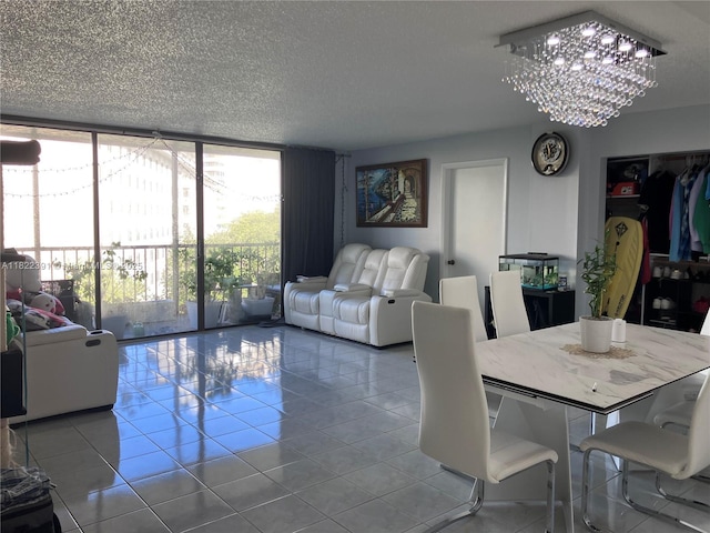 17600 N Bay Rd Unit N508, Sunny Isles Beach, FL 33160 - dining area with floor to ceiling windows, tile patterned floors, a chandelier, and a textured ceiling