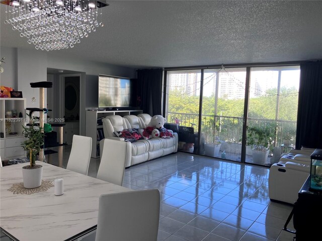 17600 N Bay Rd Unit N508, Sunny Isles Beach, FL 33160 - living room with a textured ceiling, tile patterned flooring, floor to ceiling windows, and a chandelier