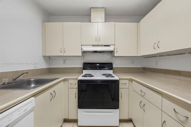 8421 SW 209th St Unit 8421, Cutler Bay, FL 33189 - kitchen with under cabinet range hood, range with electric cooktop, white dishwasher, light countertops, and light tile patterned flooring