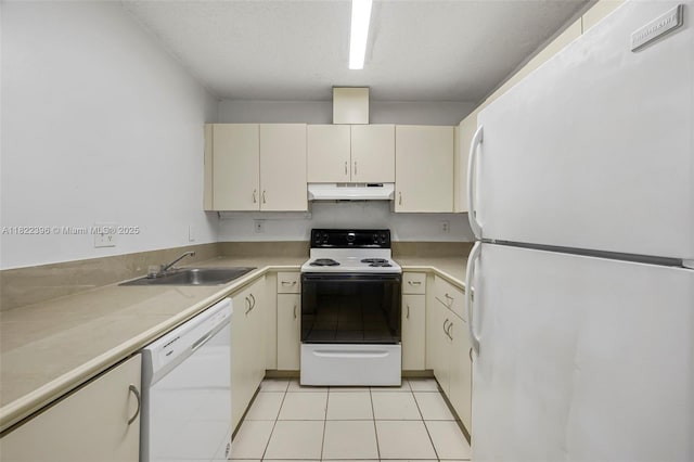 8421 SW 209th St Unit 8421, Cutler Bay, FL 33189 - kitchen featuring white appliances, under cabinet range hood, cream cabinetry, light countertops, and light tile patterned floors