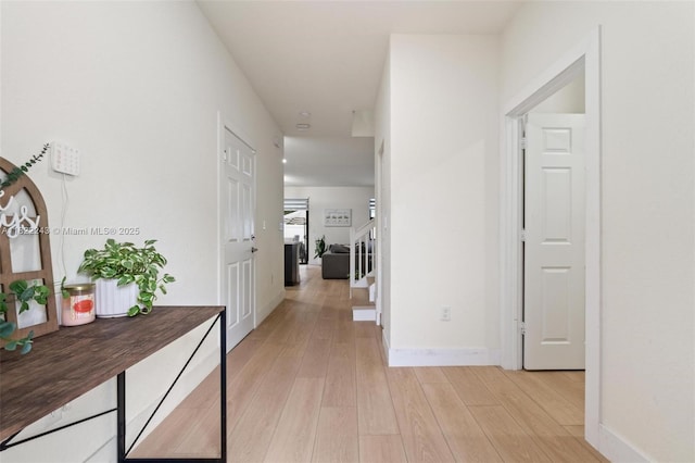 10129 W 32nd Ln, Hialeah, FL 33018 - corridor featuring light wood finished floors and stairway