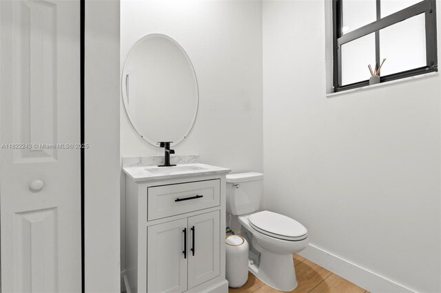 10129 W 32nd Ln, Hialeah, FL 33018 - half bath featuring vanity and wood finished floors