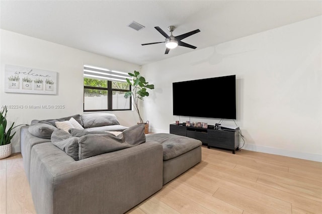 10129 W 32nd Ln, Hialeah, FL 33018 - living area with ceiling fan and light wood finished floors
