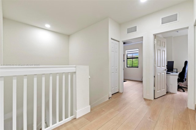 10129 W 32nd Ln, Hialeah, FL 33018 - hallway with light wood-style floors, a desk, and recessed lighting
