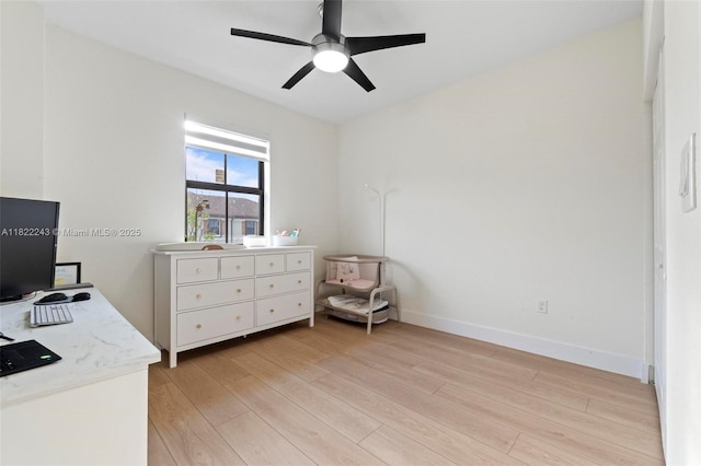 10129 W 32nd Ln, Hialeah, FL 33018 - bedroom with light wood-style floors, a desk, and a ceiling fan