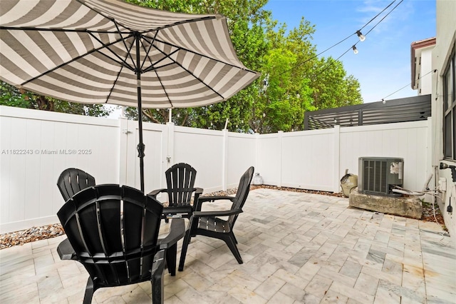 10129 W 32nd Ln, Hialeah, FL 33018 - fenced backyard with a patio area