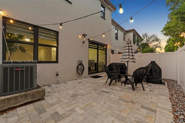 10129 W 32nd Ln, Hialeah, FL 33018 - patio terrace at dusk with a fenced backyard and a patio