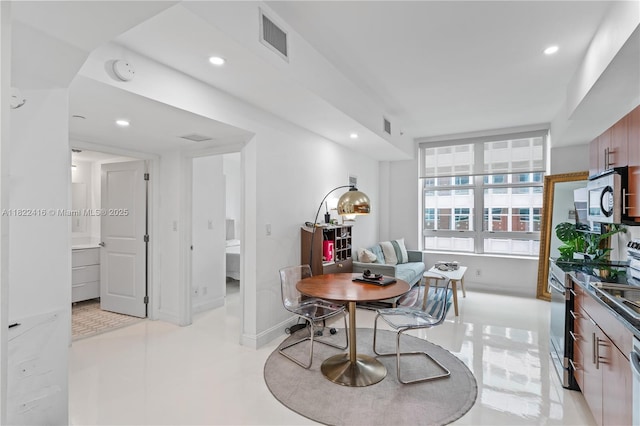 111 E Flagler St Unit 603, Miami, FL 33131 - dining space featuring recessed lighting and baseboards