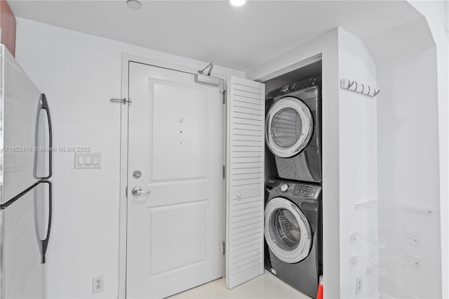 111 E Flagler St Unit 603, Miami, FL 33131 - laundry room with stacked washing machine and dryer