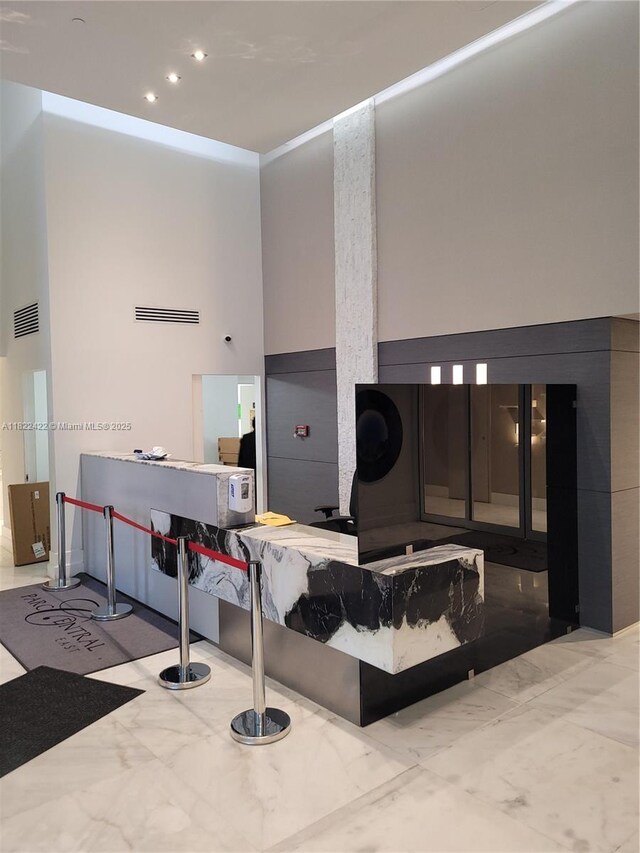 3300 NE 192nd St Unit 1008, Aventura, FL 33180 - welcome area with recessed lighting and a towering ceiling