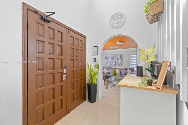 18401 SW 115th Ave, Miami, FL 33157 - foyer entrance with arched walkways, light tile patterned floors, and a towering ceiling