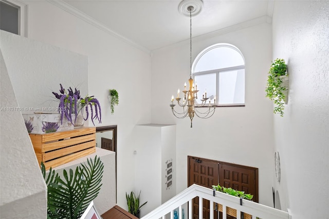 18401 SW 115th Ave, Miami, FL 33157 - hall featuring ornamental molding, a chandelier, and an upstairs landing