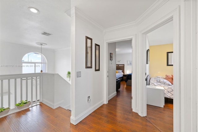 18401 SW 115th Ave, Miami, FL 33157 - hallway featuring dark wood-style flooring, crown molding, and an upstairs landing