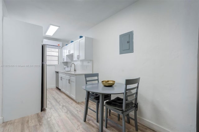 4015 Indian Creek Dr Unit 106, Miami Beach, FL 33140 - dining room featuring electric panel and light wood-type flooring