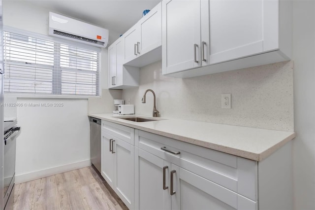 4015 Indian Creek Dr Unit 106, Miami Beach, FL 33140 - kitchen with a wall mounted air conditioner, white cabinetry, light wood-style floors, dishwasher, and backsplash