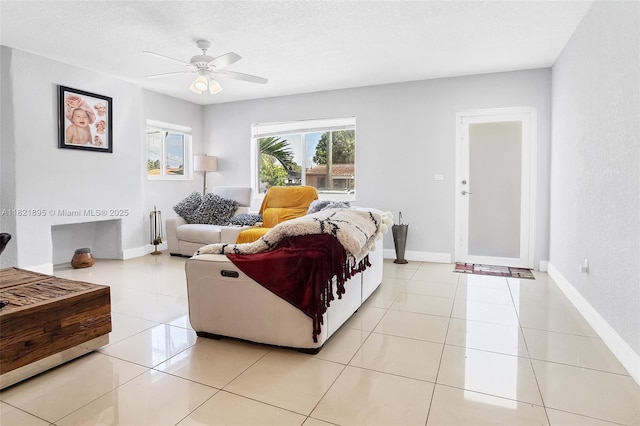 3430 NW 16th St, Miami, FL 33125 - living room featuring a ceiling fan, light tile patterned floors, and a textured ceiling