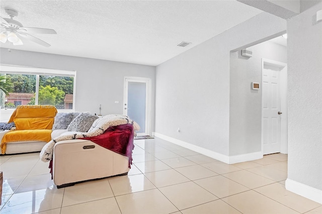 3430 NW 16th St, Miami, FL 33125 - living room featuring ceiling fan, a textured ceiling, and light tile patterned flooring