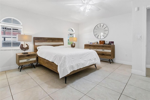 3430 NW 16th St, Miami, FL 33125 - bedroom with light tile patterned flooring and a ceiling fan