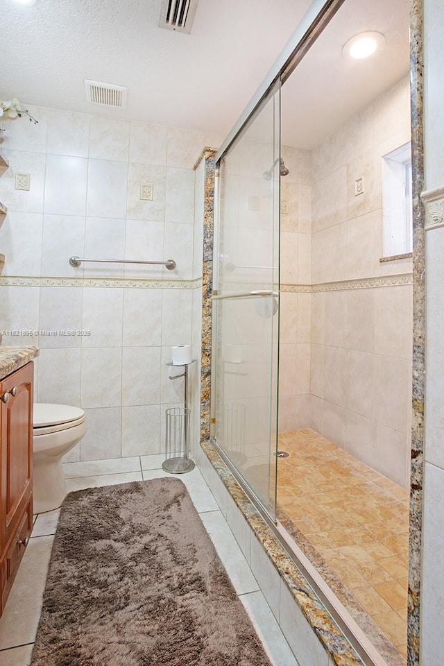 3430 NW 16th St, Miami, FL 33125 - full bath featuring a stall shower, vanity, tile patterned flooring, and tile walls