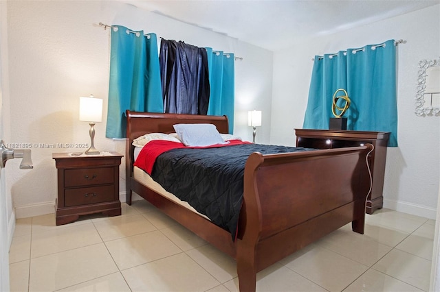 3430 NW 16th St, Miami, FL 33125 - bedroom featuring light tile patterned floors and baseboards