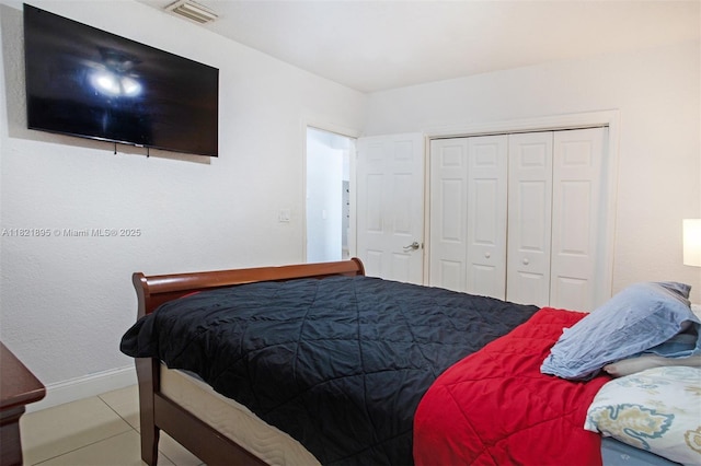 3430 NW 16th St, Miami, FL 33125 - bedroom featuring tile patterned floors and a closet