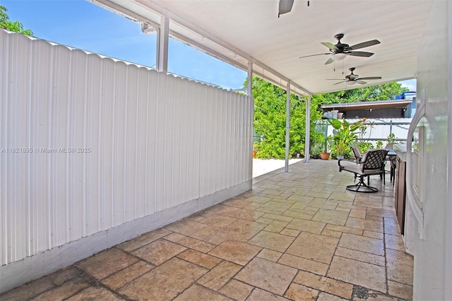 3430 NW 16th St, Miami, FL 33125 - fenced backyard featuring a ceiling fan and a patio