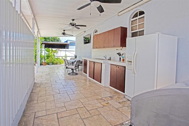 3430 NW 16th St, Miami, FL 33125 - view of patio with area for grilling, outdoor dining area, and a ceiling fan