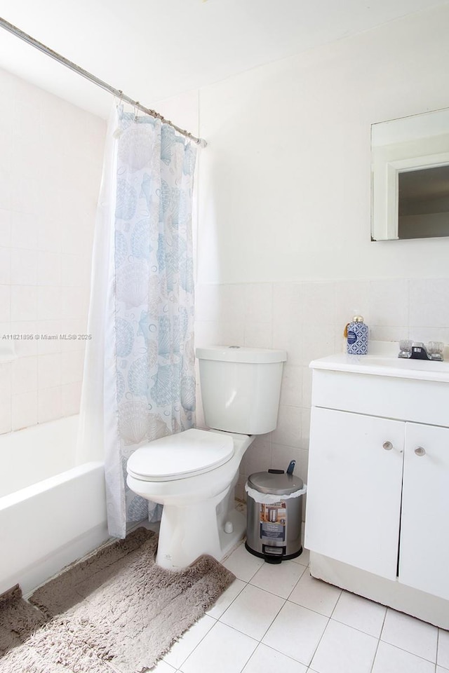 3430 NW 16th St, Miami, FL 33125 - full bath with vanity, shower / tub combo, tile patterned flooring, tile walls, and wainscoting