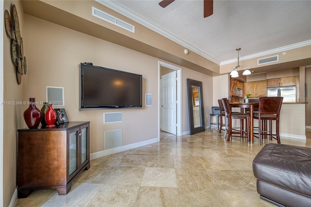 1755 E Hallandale Beach Blvd Unit 608E, Hallandale Beach, FL 33009 - living area featuring ornamental molding, a textured ceiling, and ceiling fan