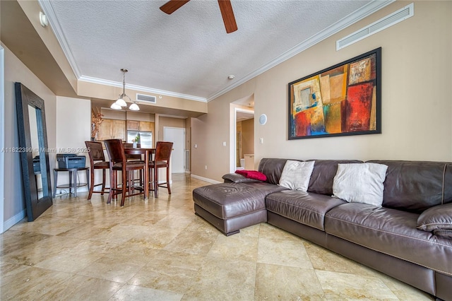1755 E Hallandale Beach Blvd Unit 608E, Hallandale Beach, FL 33009 - living room with ceiling fan, a textured ceiling, and crown molding