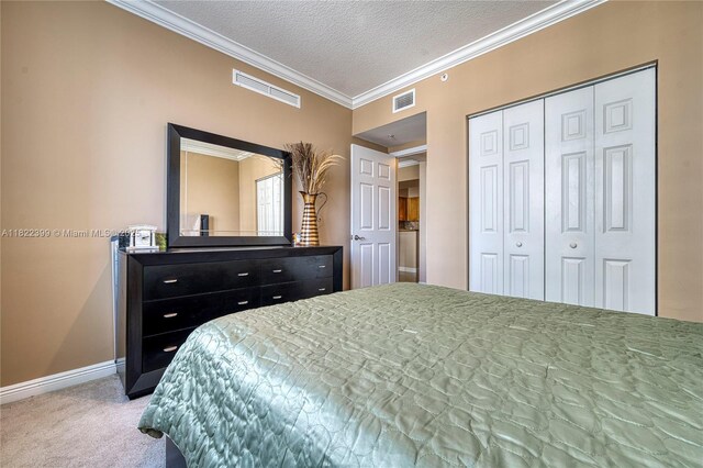 1755 E Hallandale Beach Blvd Unit 608E, Hallandale Beach, FL 33009 - carpeted bedroom with ornamental molding, a closet, and a textured ceiling