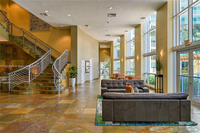 1755 E Hallandale Beach Blvd Unit 608E, Hallandale Beach, FL 33009 - lobby with a towering ceiling, stairway, and recessed lighting